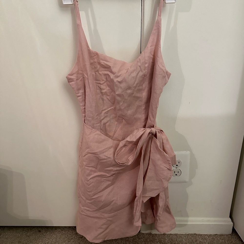 Princess Polly mini dress, size 4, light pink, wrap tie skirt in the front.